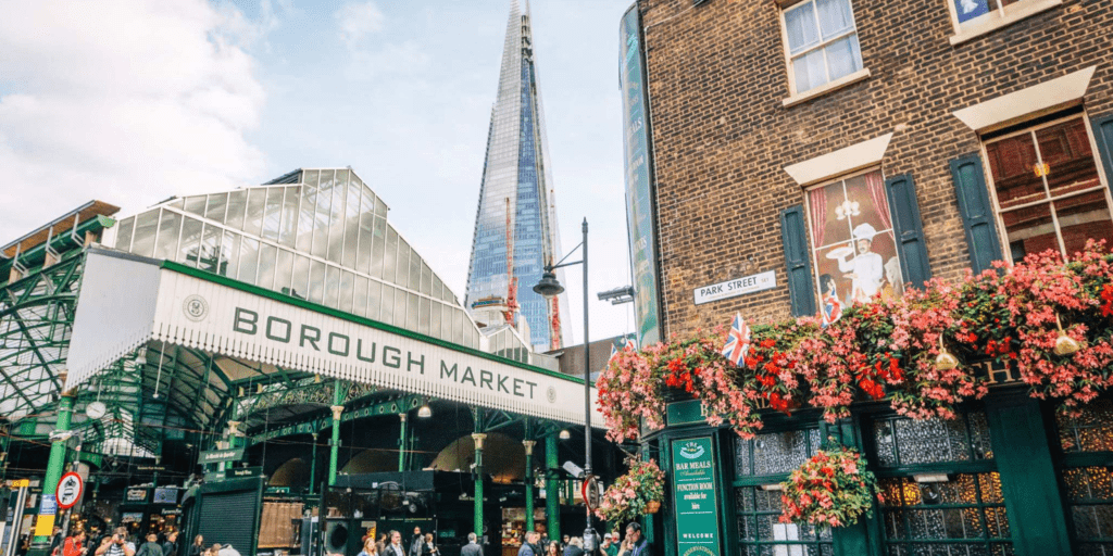 A picture taken in front of the Borough Market. Behind, we can see the Shard.