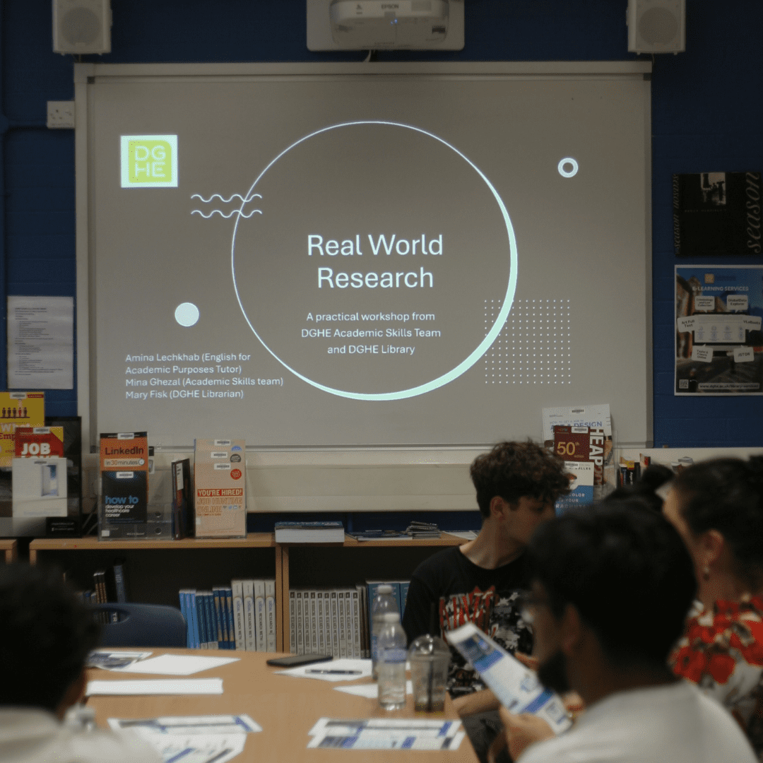 students sitting in a library on real world research workshop